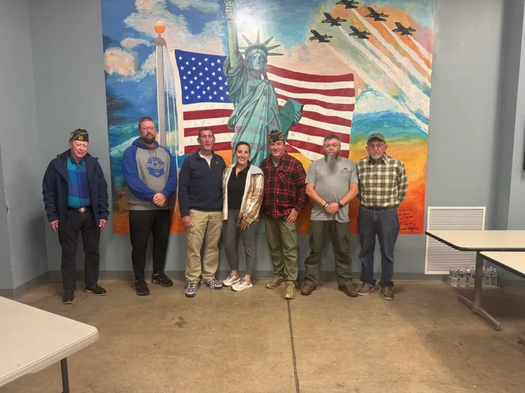 About | Commercial Roofing Contractors PA Combat veterans at Lock Haven VFW Post 1630 thank RTG Solutions for installing a new rubber roof and supporting the community