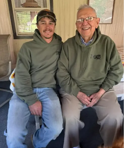 Robbie Getz, Vice President of Operations at RTG Solutions, sitting with his grandfather—the original roofer and estimator who began the family’s commercial roofing legacy in Pennsylvania.