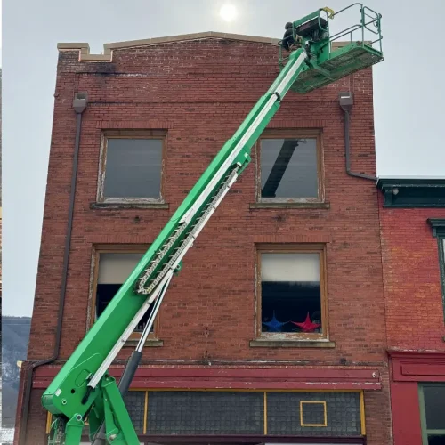 Lift access used by RTG crew to repair exterior façade of Maxwell Building