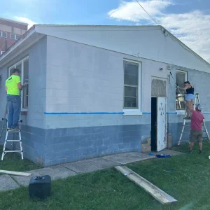 RTG Solutions Founders and Team Renovating Company Office RTG Solutions founders Sarah, Robbie, and estimator Tyler working together during early office renovation in Lock Haven, PA.