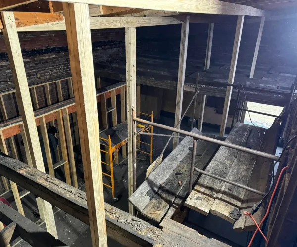 RTG Solutions new construction project at the Maxwell Building in Renovo, PA, featuring demolition, new truss framing, R-30 EPDM roofing installation, coping stones, and masonry repairs for the Greater Renovo Heritage Park.