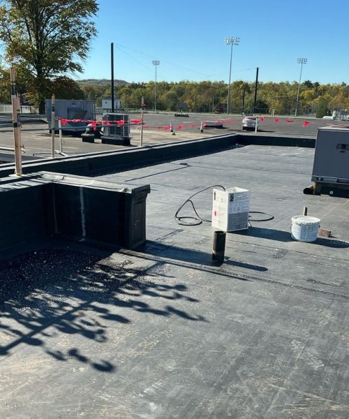 Completed section of new single-ply roof membrane installed by RTG Solutions at Shippensburg University in Shippensburg, PA, part of a government roof replacement project with upgraded insulation and edge details.