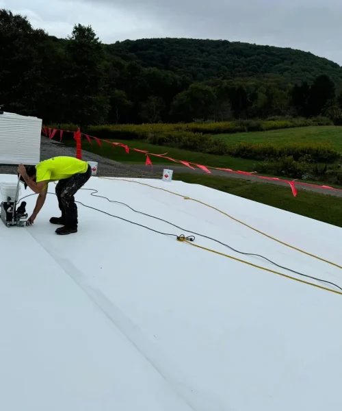 RTG Solutions team installing a TPO roofing system with heat welding for a commercial reroof project in Central Pennsylvania.